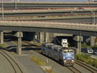 The first departure of the afternoon from Central Station for Mascouche has just passed under the Turcot Interchange with AMT 1347 and three multilevel cars.