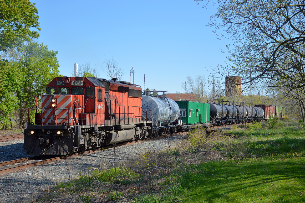 CP GMDD SD40-2 #6043 is on the head end of the Weed Sprayer on a beautiful spring afternoon in... Wait, Niagara Falls!? Yep, you read that right. CP's vegetation control train took a trip up the Montrose Spur right up to the Junction with the Chippawa Spur in Niagara Falls. This is probably the first time a 6 axle locomotive has been on this line since November 30th, 2001.