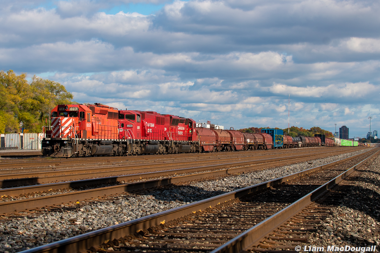 Trick Or Treat 


It was all treats for railfans from the Canadian Pacific on Halloween this year, but maybe a little bit of a trick for the crew of this Toronto-bound manifest/ballast train. They had made their way down the last part of the Mactier Sub and onto the North Toronto within the first hour of daylight, but were halted at Leaside due to a major train traffic jam getting into Toronto Yard ahead of them. 4 eastbound trains, 2 westbounds, plus 4 continuous RC Yard Jobs always up to something. Eventually at around 11:30am, they were instructed to run around their train and head to Lambton instead. This made quite a few eyes turn as the lone SD40-2 in this consist was facing west and would end up being the one leading into Lambton. And here they are, sitting in the Lambton 5 yard track shortly after the crew hopped on a taxi to take them back to Agincourt. What a day!
