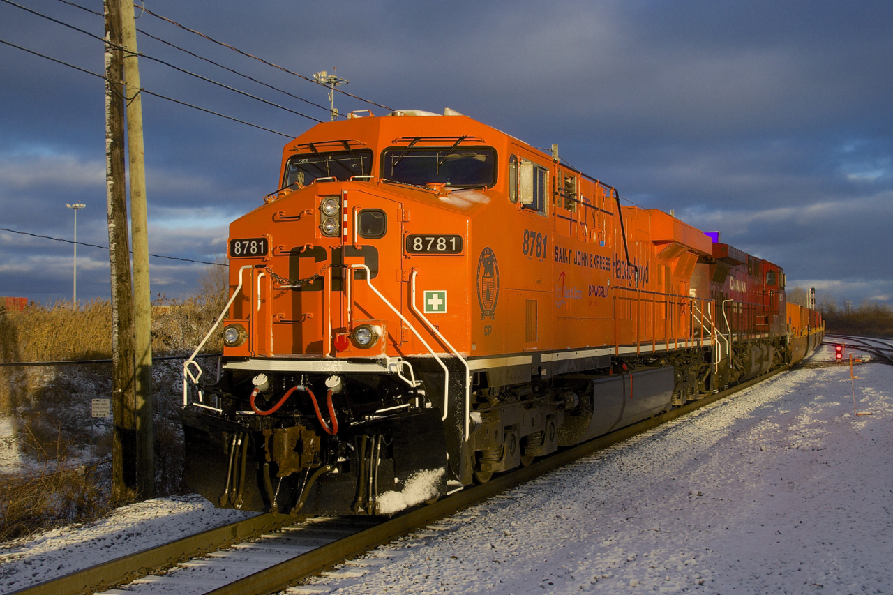 Specially painted CP 8781 leads CP 143 as it does moves in Lachine not too long before sunset.