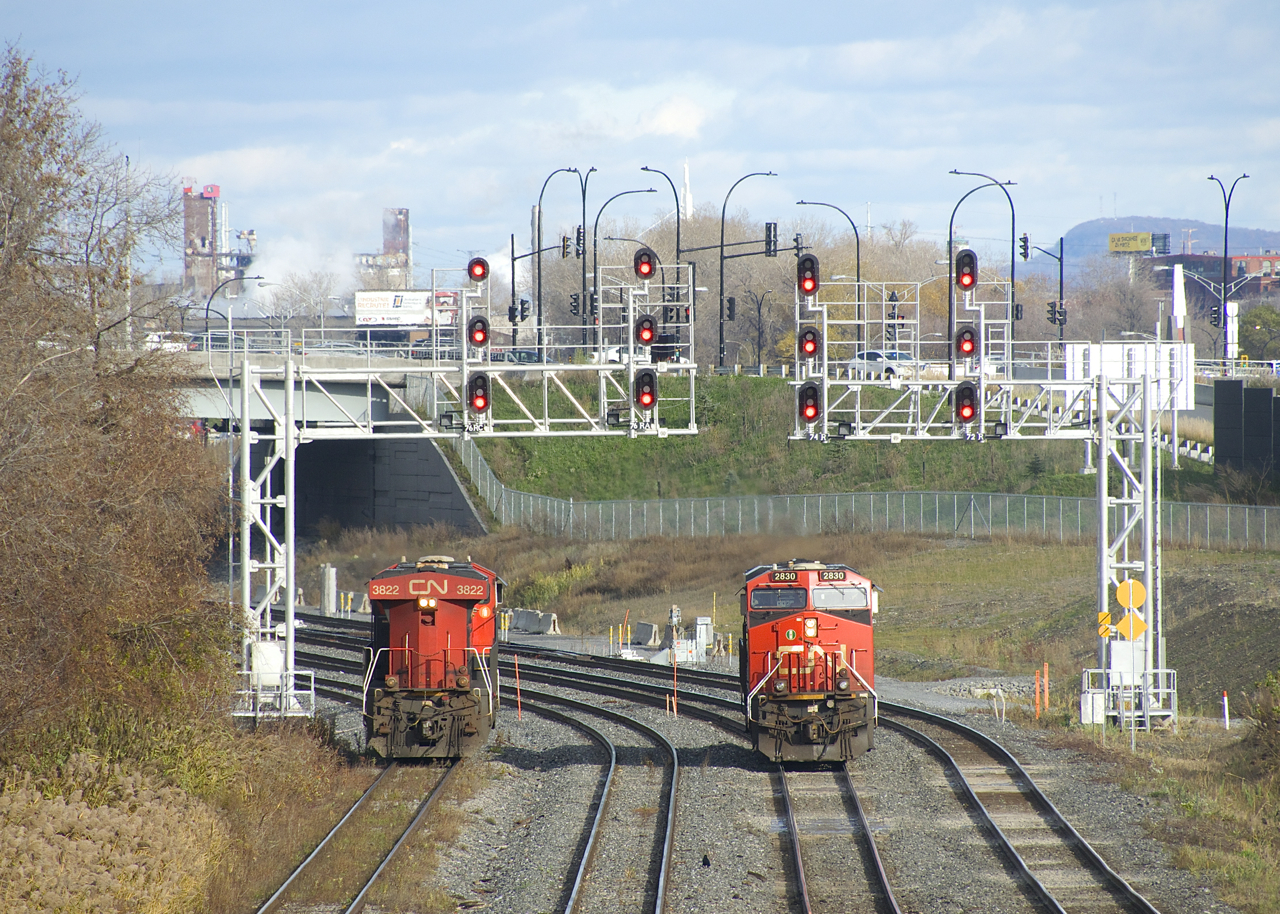 CN 305's trailing unit (CN 3822, at left) is being brought to Taschereau Yard by in the inbound crew, as the outbound crew prepares to back the leader (CN 2830, at right) back to its train.
