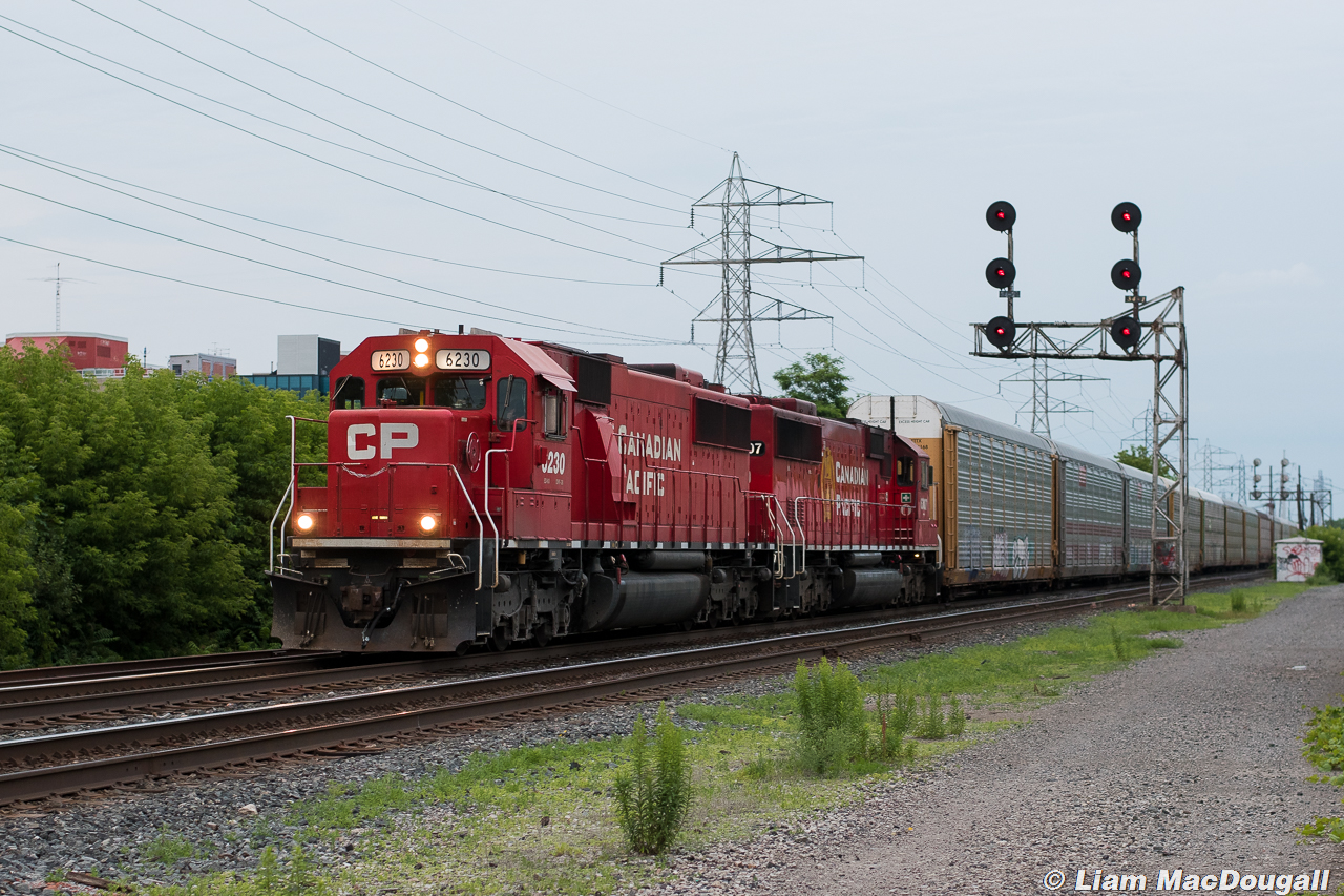 A pair of former SOO SD60s take the lead of the nightly Spence Turn as they move west through the Howland searchlights on a hazy June evening. Throughout the month of June, CP treated us with SD60s making regular appearances on T49 every week, and seems to have toned it down come July. Luckily I had the peace of mind to head out most evenings to catch them, and got rewarded a handful of times.