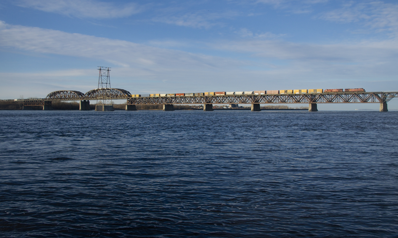 CP 8632 & CP 8900 are the power on CP 253 as it crosses the St. Lawrence River a bit later than usual.