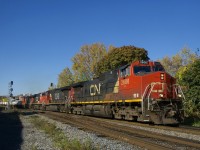 Three Dash9's and an ES44DC (CN 2606, CN 2605, CN 2256 & CN 2537) lead CN 120 past MP 3 of CN's Montreal Sub.