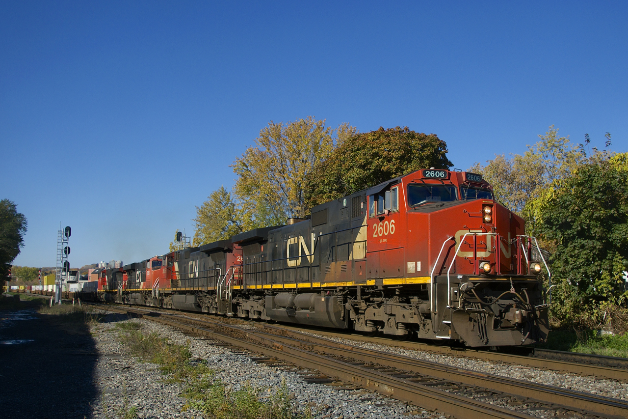 Three Dash9's and an ES44DC (CN 2606, CN 2605, CN 2256 & CN 2537) lead CN 120 past MP 3 of CN's Montreal Sub.