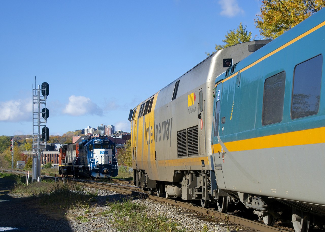 Light power has just come off of the East Side Canal Bank Spur and is waiting for VIA 35 to pass before it can cross over to the South Track and head back to Pointe St-Charles Yard.