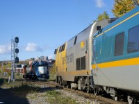 Light power has just come off of the East Side Canal Bank Spur and is waiting for VIA 35 to pass before it can cross over to the South Track and head back to Pointe St-Charles Yard.