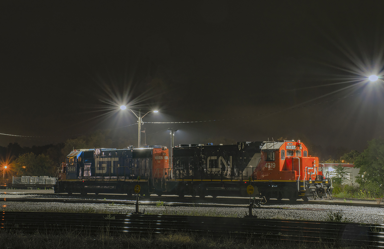 A Hamilton yard set working the 1500 job pauses under the flood lights on one of the yard leads while the crew takes lunch.  They will be back to work shortly after to 1600 job returns from the hole.