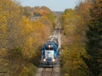 CN L568 is seen heading westbound to Stratford crossing the Nith River as it approaches the Perth Street bridge, just west of the town of New Hamburg after working the Pestell facility. 

