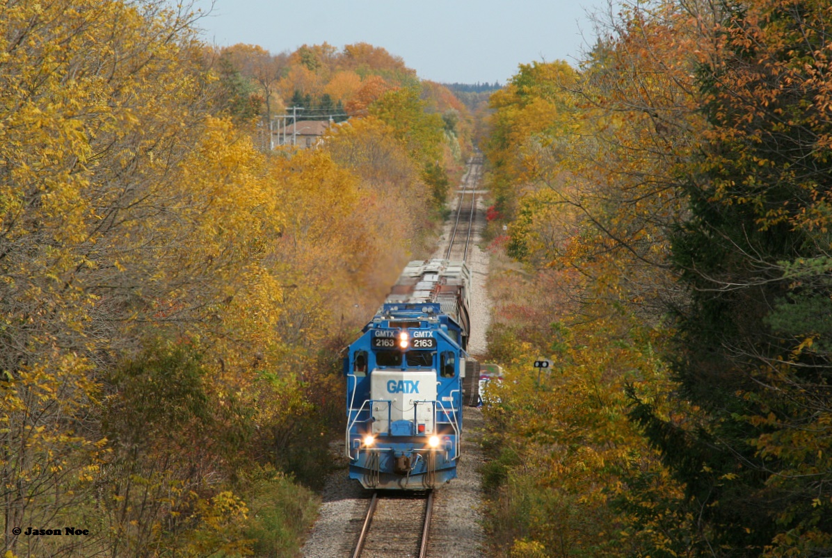 CN L568 is seen heading westbound to Stratford crossing the Nith River as it approaches the Perth Street bridge, just west of the town of New Hamburg after working the Pestell facility.