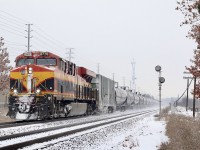 A sign of things to come? Maybe. This was definitely worth the wait, as there were some kind of issues along the way east of Wolverton. CP ethanol train 650 with a KCS leader is seen passing the clashing seasons at Meadowvale, as autumn leaves still cling to the snow covered trees. The old city water tower base, now a cell tower can be seen in the distance, while the older searchlight signal in the foreground still remains amongst a subdivision full of newer LED signals. 
