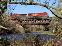 I was quite impressed that I was able to catch CP 234 two days in a row this week, especially when you throw in morning school runs. Typically it sneaks through while I'm doing my school drop off, or in the pre dawn hours. As tiresome as CP's fleet of GE's get these days I have to admit I have taken a liking to the rebuilt AC 4400's, especially in sharp and clean beaver paint. Here 234 adds a splash of red to the somewhat disappointing fall colours along the Credit River this year in Streetsville. Unfortunately the bright orange BNSF GE is buried in the trees in third position. I love this spot in the valley below all the city noise, with the constant flow of the river being the only sound. Numerous turkey vultures can be seen in the sky in the distance and have been very prevalent this year in Southern Ontario.