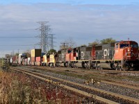 It has been a long time since I have ventured into Burlington West. It isn't what it used to be but was my only chance to catch CN 422 before it headed away from the sun. I first caught it earlier before working Aldershot but then noticed two bright yellow switches sitting at the east end of the yard, and as luck had it the pair were the only lift for 422 this day. Originally Stelco 84 & 89 and stationed at the companies Hamilton plant, the pair are now surplus and restenciled LDSX 6084 & 6089. CN 422 is seen with a trio of SD75's up front with the pair of switchers as they head onto the Halton sub. 
