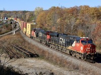 Burnt autumn colours are all around from the scenery to the train, as CN 148 coasts its way through Bayview on a beautiful fall day.