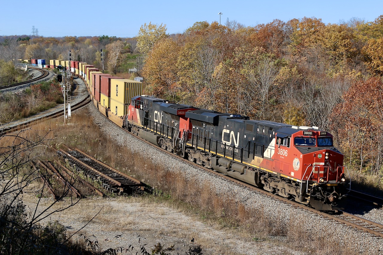Burnt autumn colours are all around from the scenery to the train, as CN 148 coasts its way through Bayview on a beautiful fall day.