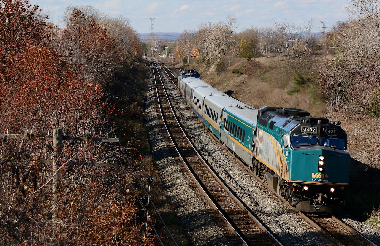 My trips to the Newtonville area are not what they once were. My younger railfanning years are full of so many good memories of spending hours with railman friends at so many of the old wooden bridges Wirth great scenery and interesting motive power from all railroads. Today VIA traffic seems to dominate most trains on most trips with little variety, while the scenery is still beautiful, many of my old haunts are now gone with the removal of a number of old bridges along the line. Time rolls on and one has to make the most of what is handed to them. It seems that today many of the trains rolling through the area are dominated by 1+1 DPU consists. In this case even the VIA train almost looks like a DPU set up, but obviously not the case. Stephenson Road is still a favourite location for me and my boys when in the Newcastle/Lovekin area. The fading autumn colours certainly helped make the shot.