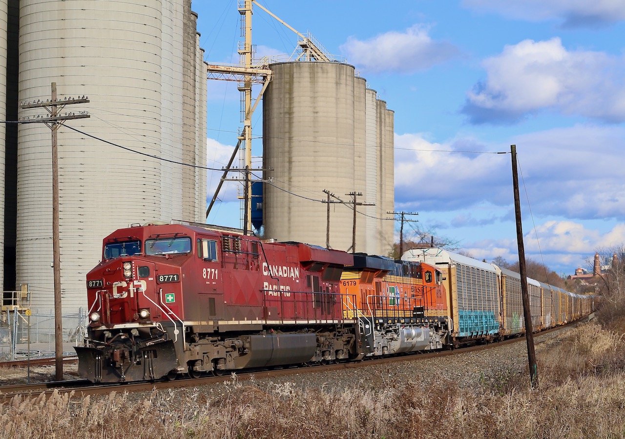 The BNSF 25th anniversary engines are certainly impressive, especially considering the effort CN put in for its 100th, LOL. The BNSF scheme certainly stands out in the crowd though I do miss the original logo over the "swoosh". Hearing that 6179, one of a group of 25th anniversary units had made it into Ontario was certainly enough to make rail fans take note. I missed its eastbound trip, and figured it would head west last night on 141, but as luck had it the unit lasted long enough to head out in daylight on 147. Here the clean GEVO is seen trailing CP 8771, as it rolls past the Ardent elevator in Streetsville under decent light.