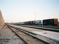 A GO Transit deadline of various locomotives and rolling stock is seen at Willowbrook Yard in Mimico, Ontario. Among the retired F’s, B-units and GP40’s was CN 561747, which was a conversion of a 40 foot boxcar painted in GO Transit colors only on the one side. For a better view of this car please see; http://www.railpictures.ca/?attachment_id=40492
