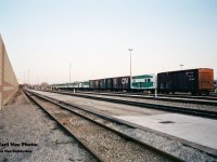 A GO Transit deadline of various locomotives and rolling stock is seen at Willowbrook Yard in Mimico, Ontario. Among the retired F’s, B-units and GP40’s was CN 561747, which was a conversion of a 40 foot boxcar painted in GO Transit colors only on the one side. For a better view of this car please see; http://www.railpictures.ca/?attachment_id=40492
