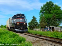 What can be more bucolic than a diminutive train passing a small farm in essa township, as the Barrie-Collingwood Railway traverses the former CNR Meaford subdivision with a single car in tow. 
