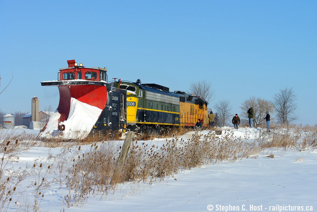 A blast from the recent past (literally) as an OSR plow extra reverses to make a 2'nd pass on a peksy drift on the St. Thomas sub. Watching are a gaggle of photographers, including James (Jim) A. Brown (centre). While I don't have the full story, Jim had a long career in the Railroad industry and is a noted photographer in our circles. Before retirement he was the General Manager of the Waterloo-St Jacobs railway and was instrumental in getting the F units for that operation. WSJR was forced into Bankruptcy around 1999, and after over a decade the affairs were settled, whether Jim arranged/nudged it or not, 6508 was OSR's first F unit acquisition in 2013 with the other going to a museum out west. In a private ceremony yesterday witnessed by his family and friends, OSR 6508 now carries Jim's name, and took a tour of the OSR in his memory. (Next photo).