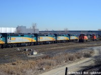 A meet at Snider West as VIA 11, equipment move to Vancouver with *five* F40's in the lead waits to reverse to the York Sub off the Newmarket connecting track. 11 would be reversing not too long after this shot was taken, and you can now sense our nervousness, the CN intermodal train might just block us entirely from the shot on this beautiful March day. After biting our nails and pacing a bit in excitement, we'd actually still get the shot, despite the westward reverse move happening with a CN freight blocking our view, we'd get the VIA's eastbound movement just moments after the tail end of the freight passed, and we'd also go home with this meet shot which would have been impossible otherwise<br><br>Here's <a href=http://www.railpictures.ca/?attachment_id=42247 target=_blank>Steve Bradley's beautiful view of the same train from Parry Sound</a>.