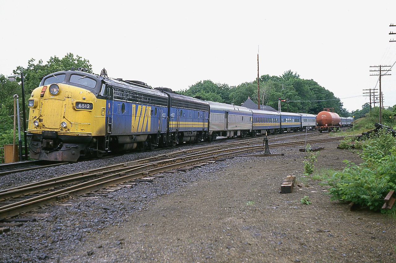 The 'Toronto-bound' section of the VIA Canadian stops at Parry Sound for passengers.  VIA 6512 and 6621 is the power.  The 6512, after doing its' time with VIA, was dealt off and became KCS 1 and then KCS 2, as power on the Kansas City Southern business train. Unit was built back in 1955.