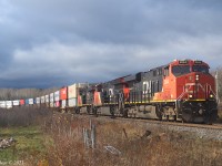 Nov 14th 2021 @ 14:16 AT, Z120 at MP 42.5 CN Springhill sub (Thomson Road). 634 axles with CN 2844, CN 3257 and CN 2257. The leaves are gone! I've been waiting for this as it reveals the containers rounding the curve to the west of the crossing. The curve looks a lot sharper in real life than it does on the map. As a bonus the sun appeared at the right time.

