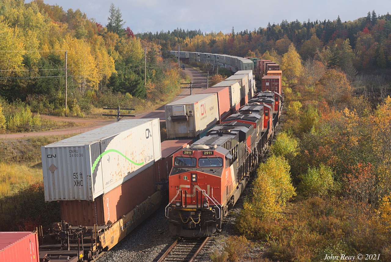Oct 15th @ 10:17, A407, all intermodal out of Rockingham yard, finally takes the siding at Springhill Jct, NS to meet Z120, which had been waiting at a red signal for almost 30 minutes. 446 axles with CN 2911, CN 2837 and CN 3816. The siding (second longest between Moncton and Halifax) is 11,350 ft. Z120 is 12,806 feet, and A407 is 9,732 ft. You do the math.