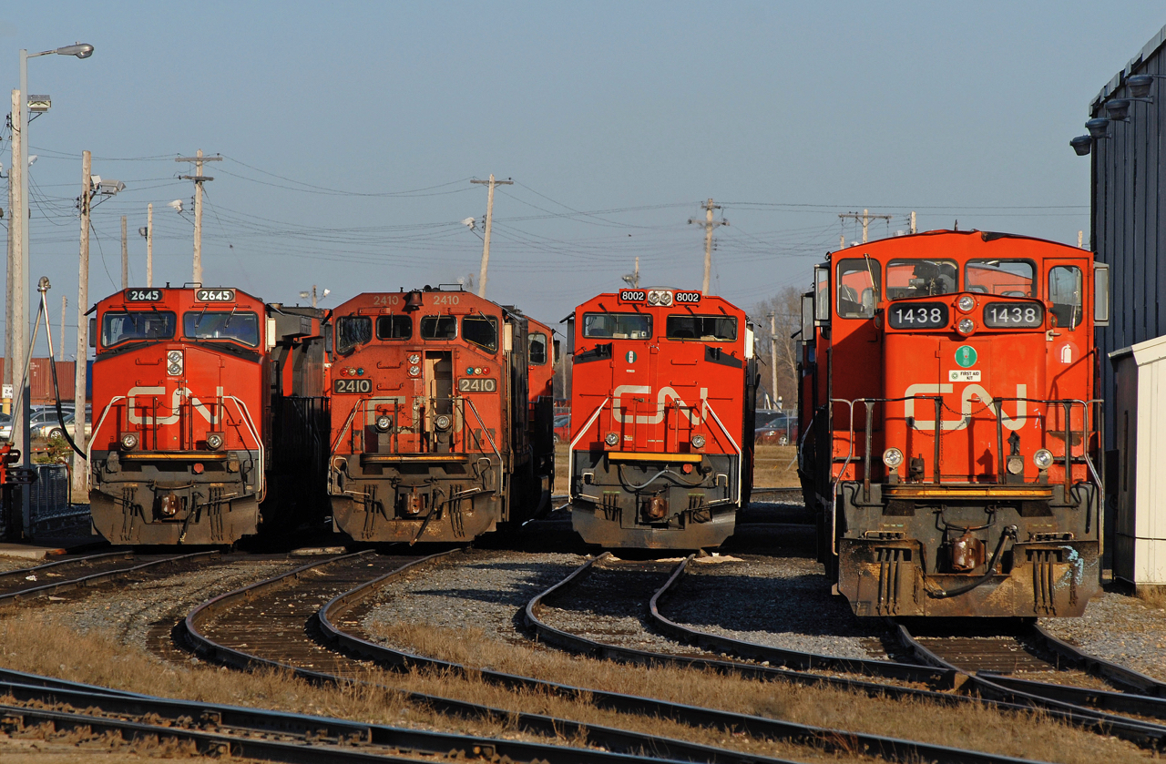 A little bit of CN variety sits next to the diesel shop in Saskatoon Yard. Personally I'll take the one on the right to work with or photograph.