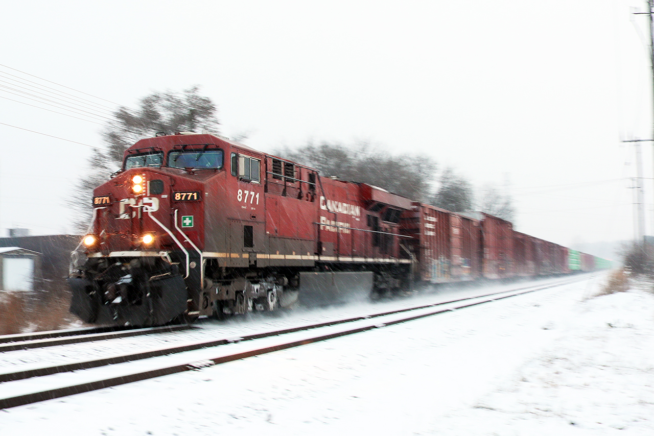 11000 feet, 35mph and a GE DPU have 235 streaming into Galt on a snowy morning. 235 seems to have triple the usual container traffic today begging the question if St John is generating traffic, or if it's all out of Montreal. Regardless, 235 has things well in hand as they prepare to take on Orr's Lake Hill =, just across the Grand River.