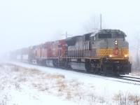 After a mysterious 36 hour stay in Detroit, 234 finally returned east, most importantly with 7010 still leading. The fog is thick and the air is heavy; heavy enough that you couldn't hear it whistling for a crossing only a mile away. But it near silence, as trains in the snow often are, 7010 east accelerates for its final 60 odd miles to a rest, and or hopefully, a quick turn home for the crew. Merry Christmas.