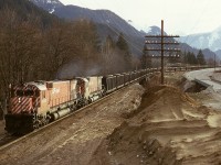 In the early years of coal train operation from southeast BC to Roberts Bank, CP MLW M-630s were regular power as they were the first CP units equipped with Locotrol, as illustrated here by 4568 and 4564 (with SD40-2 5641 and SD40 5552 and Robot car 1009 mid-train) handling coal empties eastward alongside the Trans Canada Highway and crossing Emory Creek.