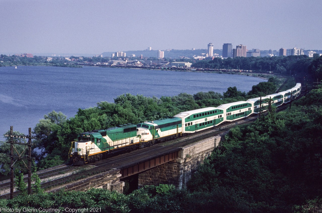 Former Rock Island GP40 724 leads a GO Transit deadhead move out of Hamilton after it came west from Toronto Union Station to the CN station in Hamilton. The deadhead move will run back to GO's Willowbrock shop complex. 

Trailing 724 is ACPU 903 was rebuilt from an Ontario Northland FP7A and provided electrical power to the train as well as providing a cab on the push end of the train. No. 904 and most of GO's other ACPUs were scrapped in 1995. I was taking the train to Toronto then and watched the daily progress as the scrapper went down the row at Willowbrock.