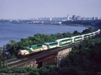 Former Rock Island GP40 724 leads a GO Transit deadhead move out of Hamilton after it came west from Toronto Union Station to the CN station in Hamilton. The deadhead move will run back to GO's Willowbrock shop complex. 

Trailing 724 is ACPU 903 was rebuilt from an Ontario Northland FP7A and provided electrical power to the train as well as providing a cab on the push end of the train. No. 904 and most of GO's other ACPUs were scrapped in 1995. I was taking the train to Toronto then and watched the daily progress as the scrapper went down the row at Willowbrock.  