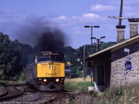 Via #45 accelerates past Port Hope station enroute to Toronto. 

The Port Hope station was built by Grand Trunk in 1856 using local limestone. CN brought forward a plan to remove the station in 1978 but was convinced by community groups to restore it and continue to use it for passenger service. It continues as a stop for a few Via trains daily. 

