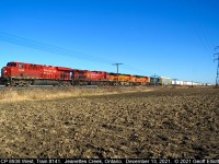 Almost like the colorful 90's on CP again!!  CP ES44AC #8938 leads westbound train #141 through the flatlands of Kent County as it approaches Jeanettes Creek Road just south of Jeanettes Creek, Ontario on December 13, 2021.  In tow are CP AC44CW #8643 with BNSF ES44C4 #6890, BNSF SD70ACe #8538, and CSX ST70AH #8900, all headed back to Chicago to be interchanged back to their home roads.  The BNSF's had come east on a 244 autorack train the day previous, but I'm not sure as to where the CSX 8900 came from.  I guess the 1 positive of PSR is the fact that foreign road power has become common on the CP making it worth going out to shoot again.  Merry Christmas everyone..........