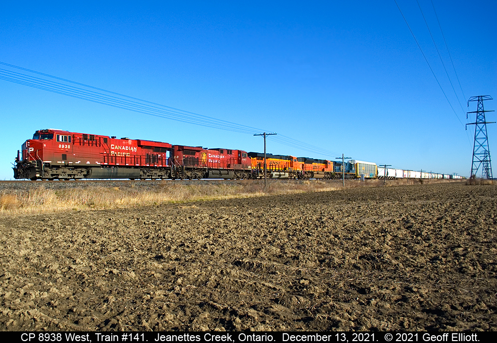 Almost like the colorful 90's on CP again!!  CP ES44AC #8938 leads westbound train #141 through the flatlands of Kent County as it approaches Jeanettes Creek Road just south of Jeanettes Creek, Ontario on December 13, 2021.  In tow are CP AC44CW #8643 with BNSF ES44C4 #6890, BNSF SD70ACe #8538, and CSX ST70AH #8900, all headed back to Chicago to be interchanged back to their home roads.  The BNSF's had come east on a 244 autorack train the day previous, but I'm not sure as to where the CSX 8900 came from.  I guess the 1 positive of PSR is the fact that foreign road power has become common on the CP making it worth going out to shoot again.  Merry Christmas everyone..........