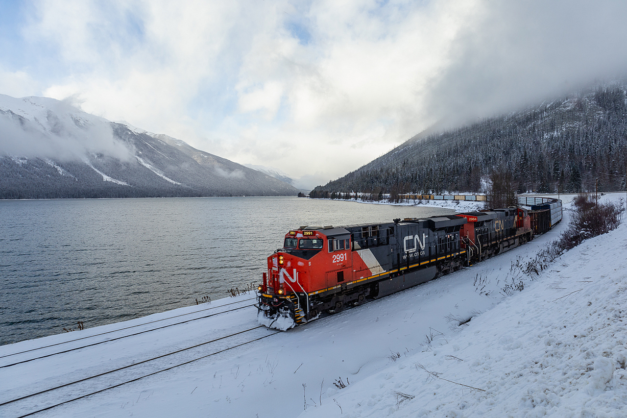 Between intermittent snow squals, M 34851 26 skirts the shore of Moose Lake, on CN's famed Albreda Sub