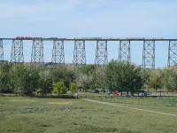 No one in the railfanning community on vacation goes by the Lethbridge Viaduct without checking it for trains. The landmark is almost a mile long and 300+ ft above the Oldman River.  So, we were not going to leave town without checking it either.  Waited an hour, but caught CP 6240 and 5049 heading west. What a sight!!