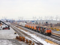 2021.12.21 CN A42231 21 with the first six units of QNS&L’s new AC44C6M order trailing arriving at CN Malport Yard, will dropped all intermodal upfront here. The consist is CN 2289/CN 2628/CN 8022/QNSL 437/QNSL 434/QNSL 435/QNSL 430/QNSL 432/QNSL 433 F/R/R/F/F/F/F/F/F.