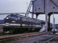 A grouping of New York Central 1951 built E8A units, all in the cigar band paint scheme, layover at Chatham Street waiting to take a train back stateside.

<br><br><i>Doug Page Photo, Bruce Acheson Collection.</i>