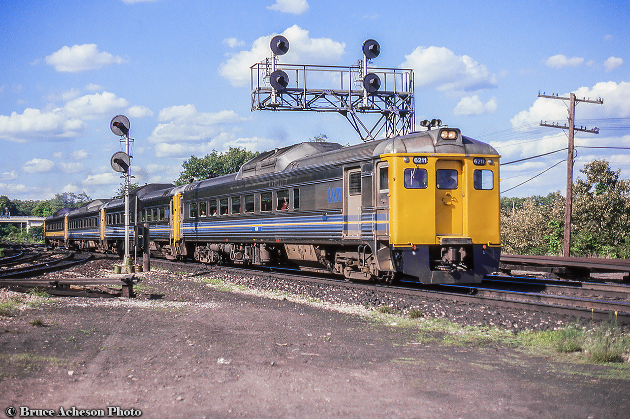 The evening Budds for Niagara are westbound through Bayview about to swing around the bay onto the Grimsby Sub.  Originating in Toronto as train 641, the number will become 642 once on the Grimsby Sub as the movement has become eastbound.  Similarly, on the return trip westbound, then eastbound, the trip will operate as 643/644.  Note the 4th RDC with yellow stripes rather than blue.