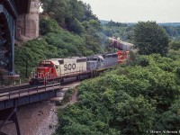 A southbound CP freight, led by a pair of SOO SD40s bracketing PC 3026 pass through Hamilton Junction before the <a href=http://www.railpictures.ca/?attachment_id=25056>1995 GO expansion.</a>  Any history on this geep is appreciated.