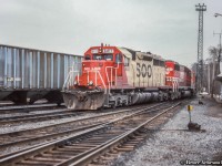 Power for the rock train moving about Aberdeen Yard.  Note <a href=http://www.railpictures.ca/?attachment_id=44384>TH&B depot at right.</a>