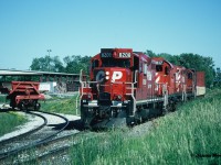 After lifting a car from the Brampton Brick Limited plant, CP 8208, 1117 and 8243, had then set-off the dump car in the small spur. The units would eventually reverse to their waiting northbound train on the Owen Sound Subdivision in Brampton once the brakeman climbed aboard the bulkhead car, which was likely sitting one crossing away at Sandalwood Parkway.  


