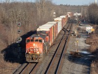 CN X369 takes down a set of old CNR searchlight’s as they’re lighting the right of way for the Kingston Sub. In the consist, are a pair of uncommon C44-9WL’s hauling mixed freight bound for Toronto on a chilly Friday evening.