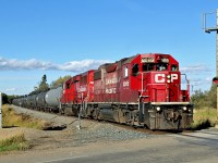 GP 38-2, CP 3065 and GP20C-ECO, CP 2221 work a local transfer of tank cars south into Red Deer.