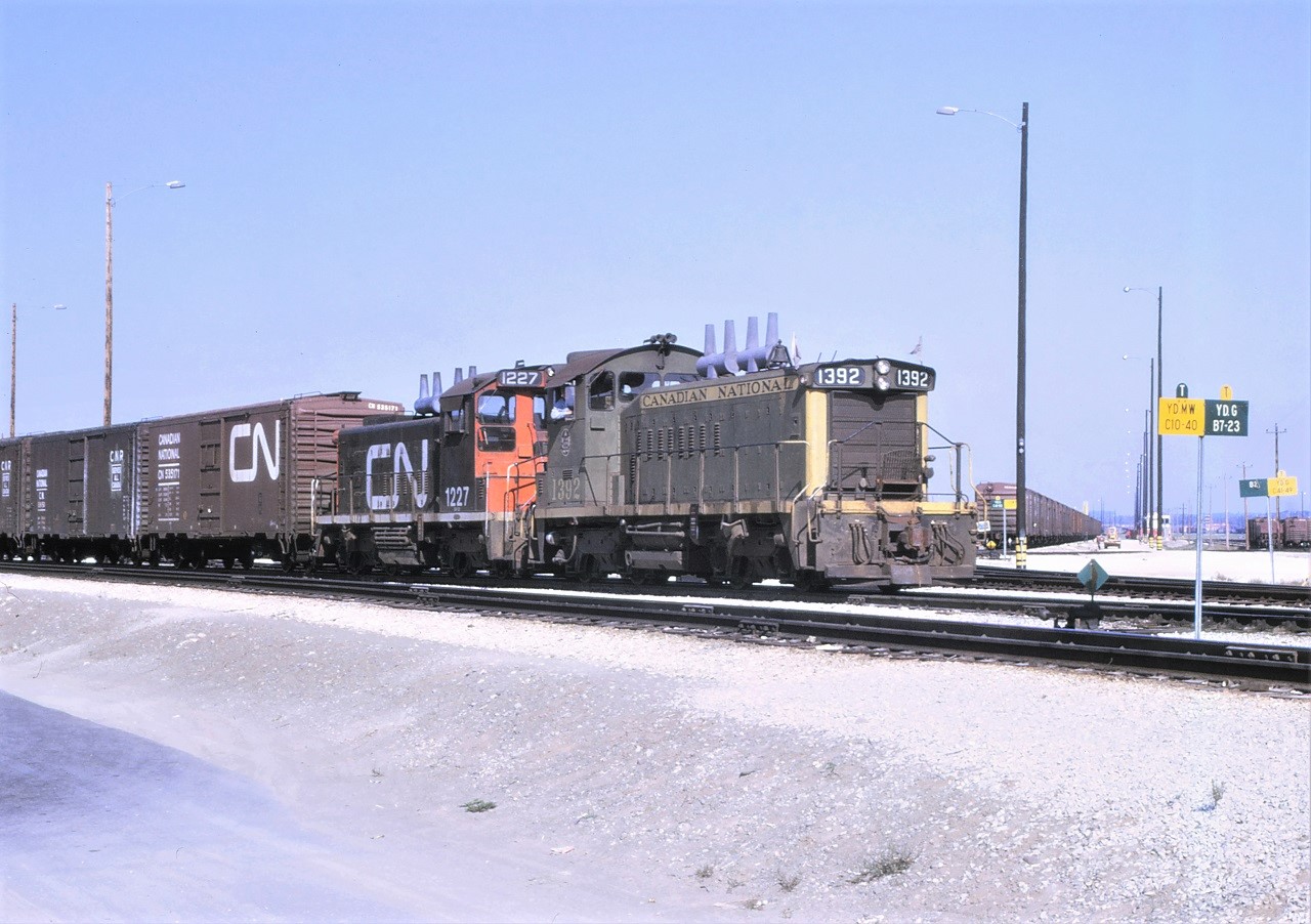One of CN's many transfer jobs heads out of the West Departure Yard.  Power for the train is a pair of SW1200RS units in the form of 1392 and 1227.