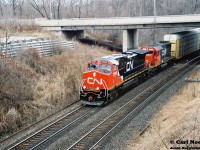Still new CN 2590 (built 12/1997) and GTW SD40 5928 in CNNA paint power a westbound through Bayview Junction, possibly train 271, bound for the Dundas Subdivision. 